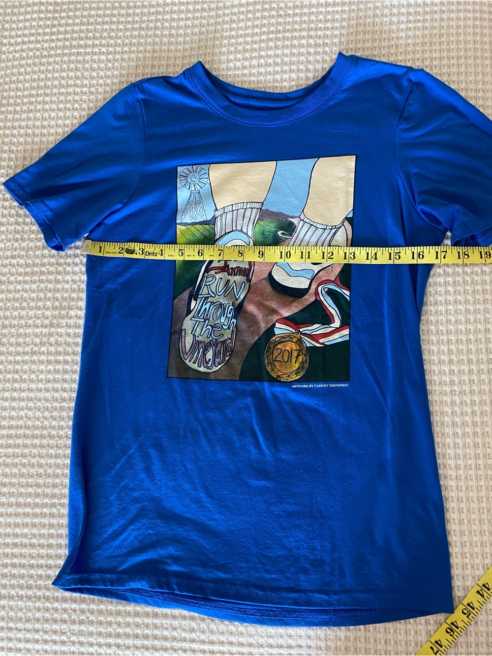 Blue Graphic Women’s T‑Shirt with Running Medallion Print